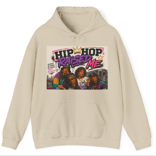 A beige pullover hoodie with a front graphic print featuring the text 'HIP HOP RAISED ME' and a colorful image of four people, shown on a plain white background.