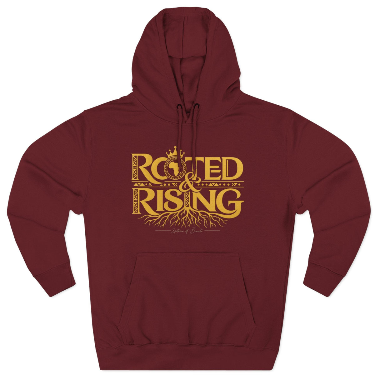 A maroon pullover hoodie with a gold graphic print on the chest reading 'ROOTED & RISING' with decorative roots and a crown, shown on a plain white background.