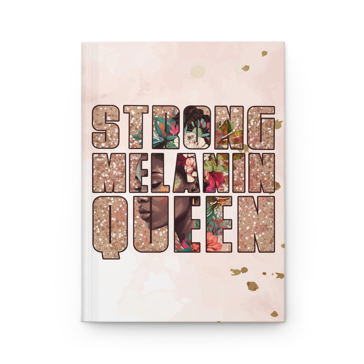 A hardcover journal with a light pink watercolor cover, featuring the text 'STRONG MELANIN QUEEN' in a bold decorative font filled with floral and patterned images. The book is centered on a clean white background.