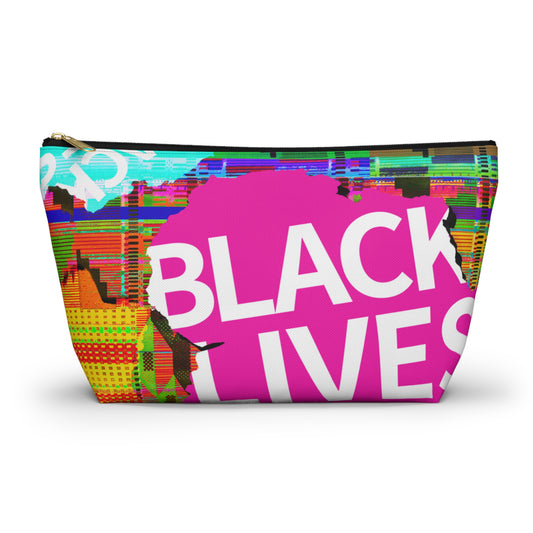 A rectangular zippered cosmetic pouch featuring a vibrant, multicolored glitch-art style graphic with a large pink shape and bold white text reading 'BLACK LIVES'.