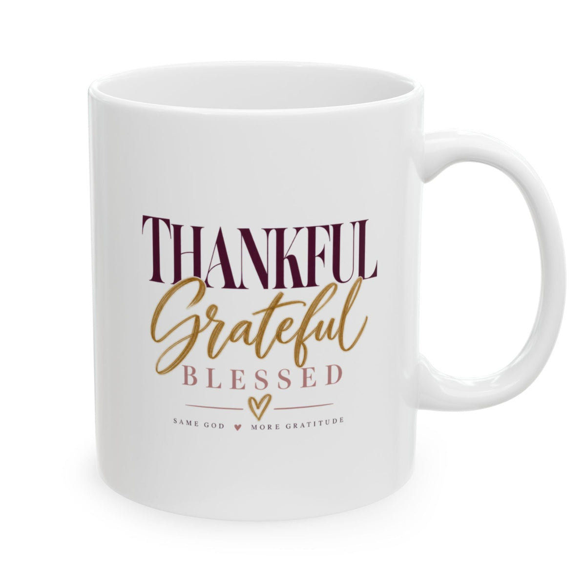 A white ceramic coffee mug with a handle, featuring the text 'THANKFUL Grateful Blessed' in dark burgundy and gold lettering, on a clean white background.