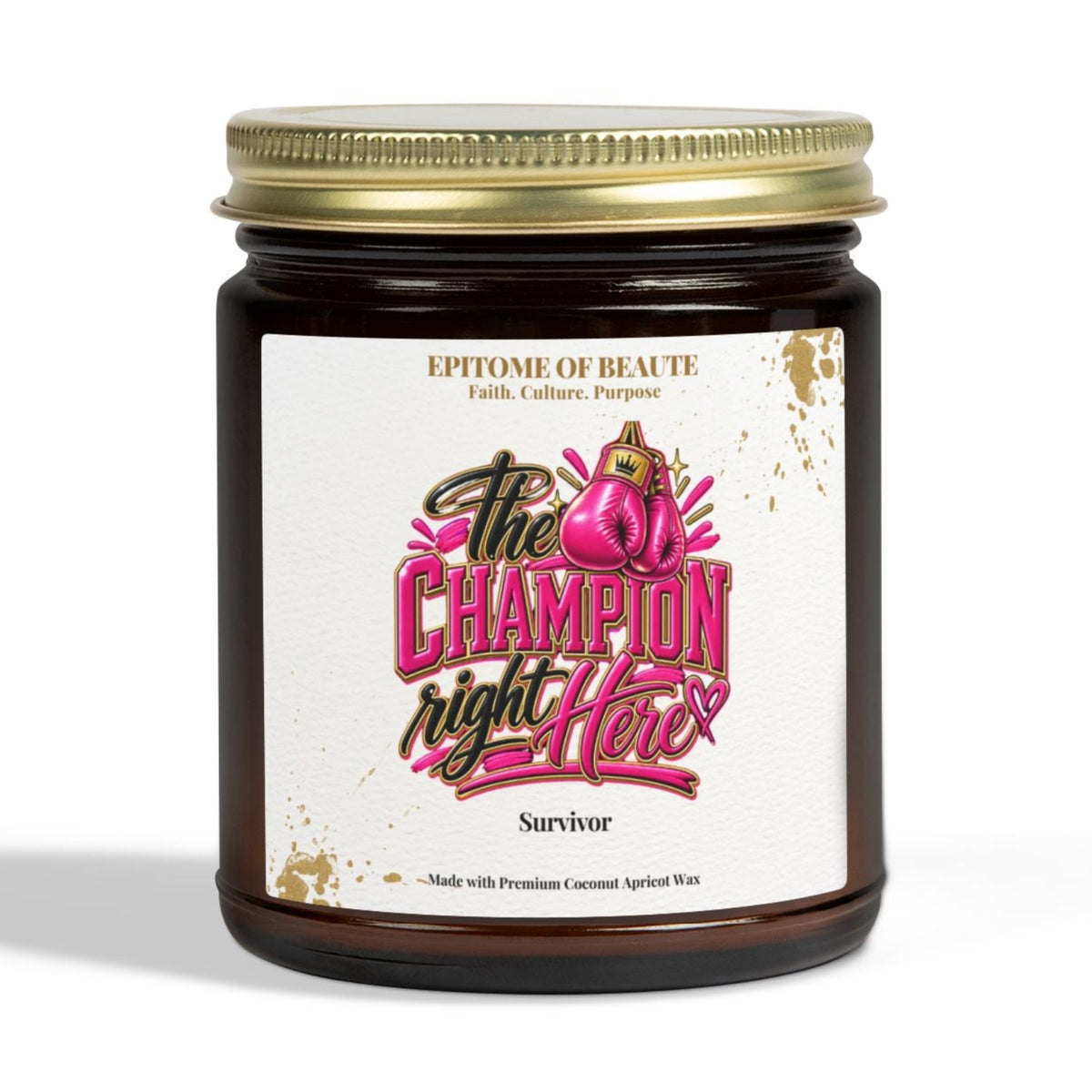 A dark amber glass jar candle with a gold metal lid and a white label featuring pink and black text that reads 'The Champion right Here' with 'Survivor' below, photographed on a clean white background.