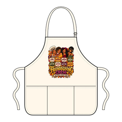 An off-white apron with a neck strap and waist ties, featuring a colorful graphic print of the 'Friends Giving Crew' logo and character illustrations on the chest, shown on a plain white background.