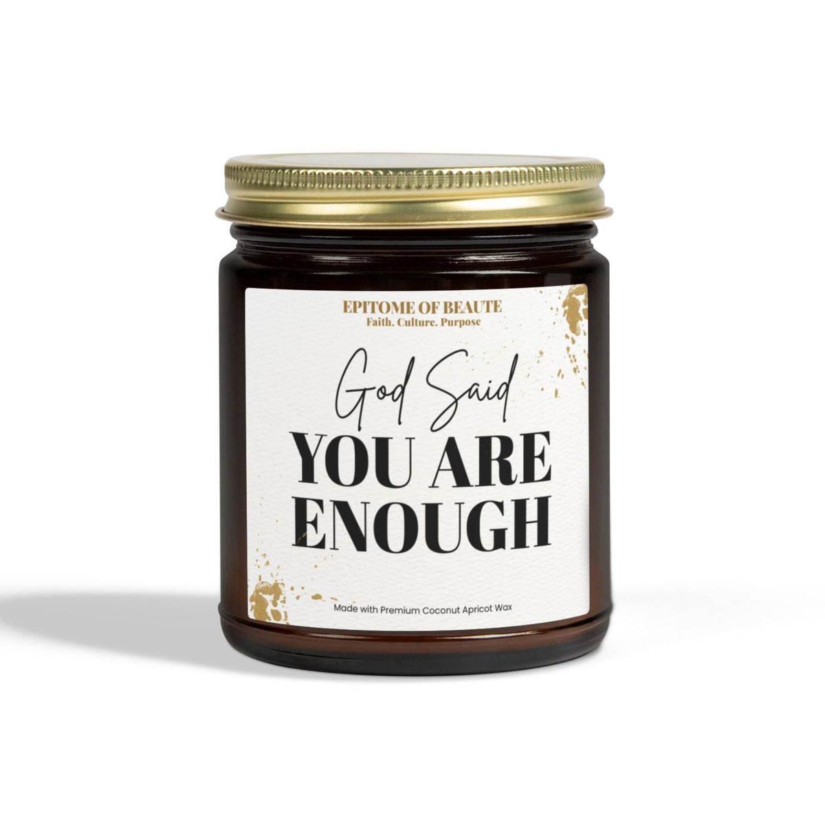 A dark amber glass jar candle with a gold metal lid and a white label that reads 'God Said YOU ARE ENOUGH' in black text, shown on a clean white background.