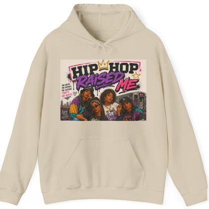 A beige pullover hoodie with a front graphic print featuring the text 'HIP HOP RAISED ME' and a colorful image of four people, shown on a plain white background.