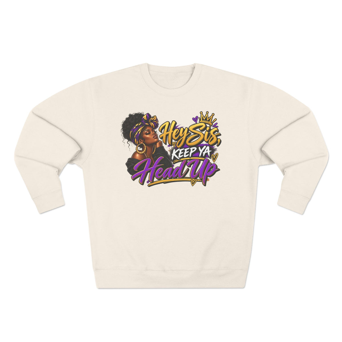 An off-white crewneck sweatshirt featuring a colorful graphic print on the front with the text 'Hey Sis, Keep Ya Head Up' and an illustration of a woman with an afro.